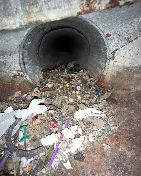 Air duct before cleaning - dirty and clogged with debris